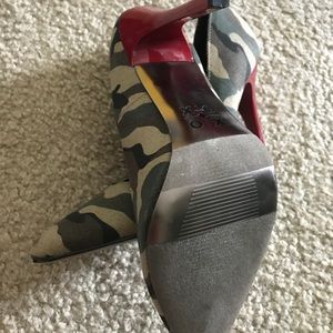 Military style red heeled pumps