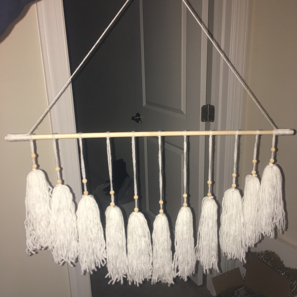 White tassel wall hanging