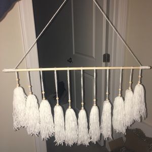 White tassel wall hanging