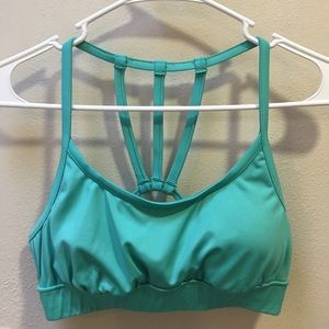 Pink lotus PL movement aqua strappy sports bra