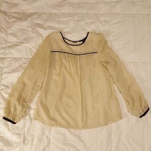 Chic cream blouse with black polka dots