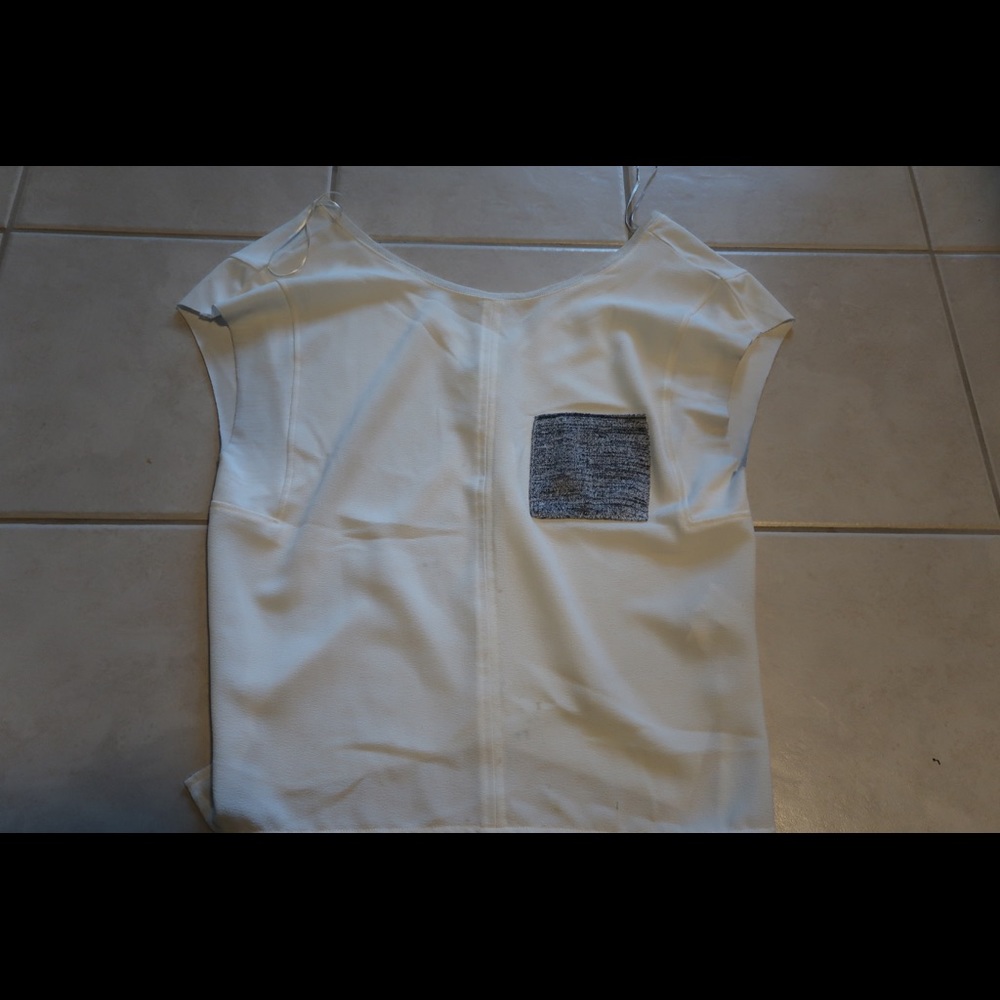 White Zara tee. Blue pocket and v back details