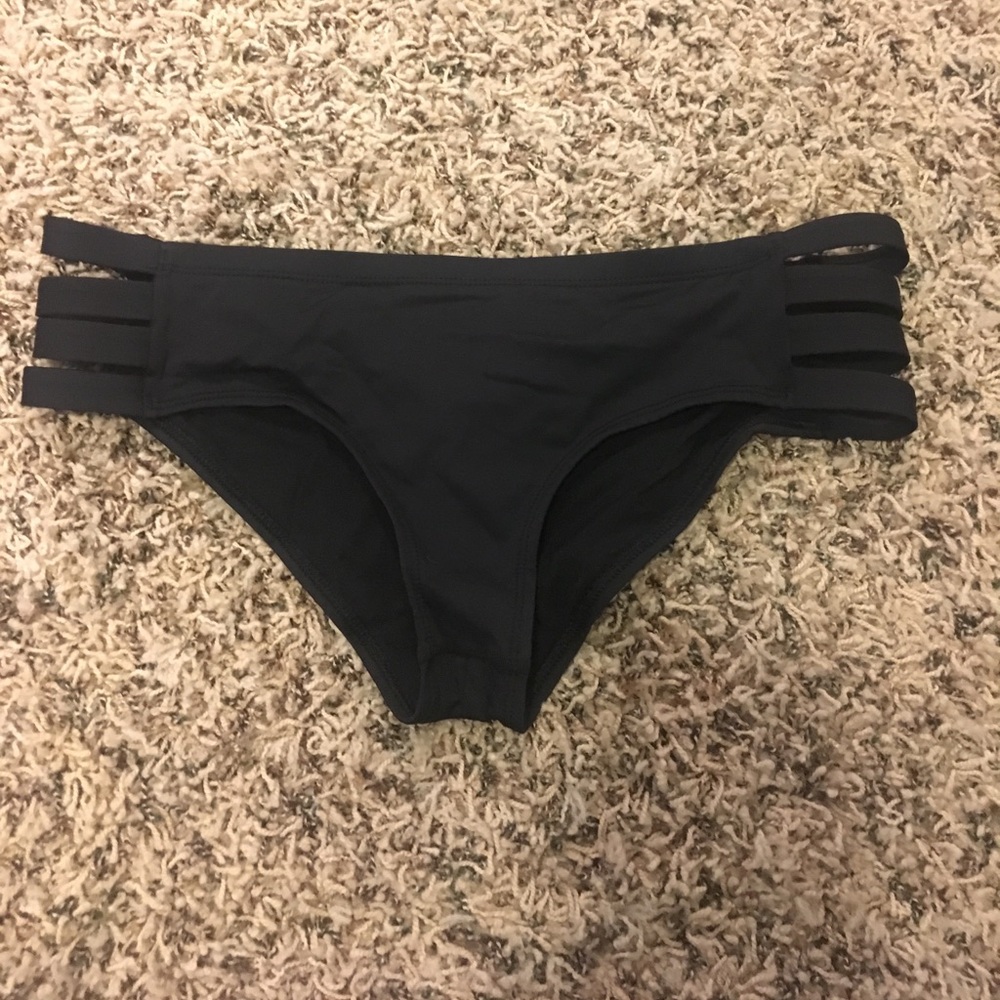Black swim suit bottoms with colorful triangle top