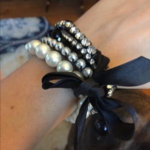 Multi-strand Express bracelet with black satin bow