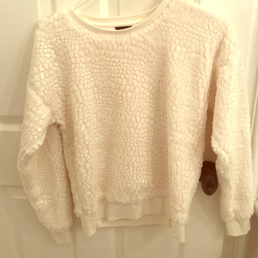 White sweater with awesome detail