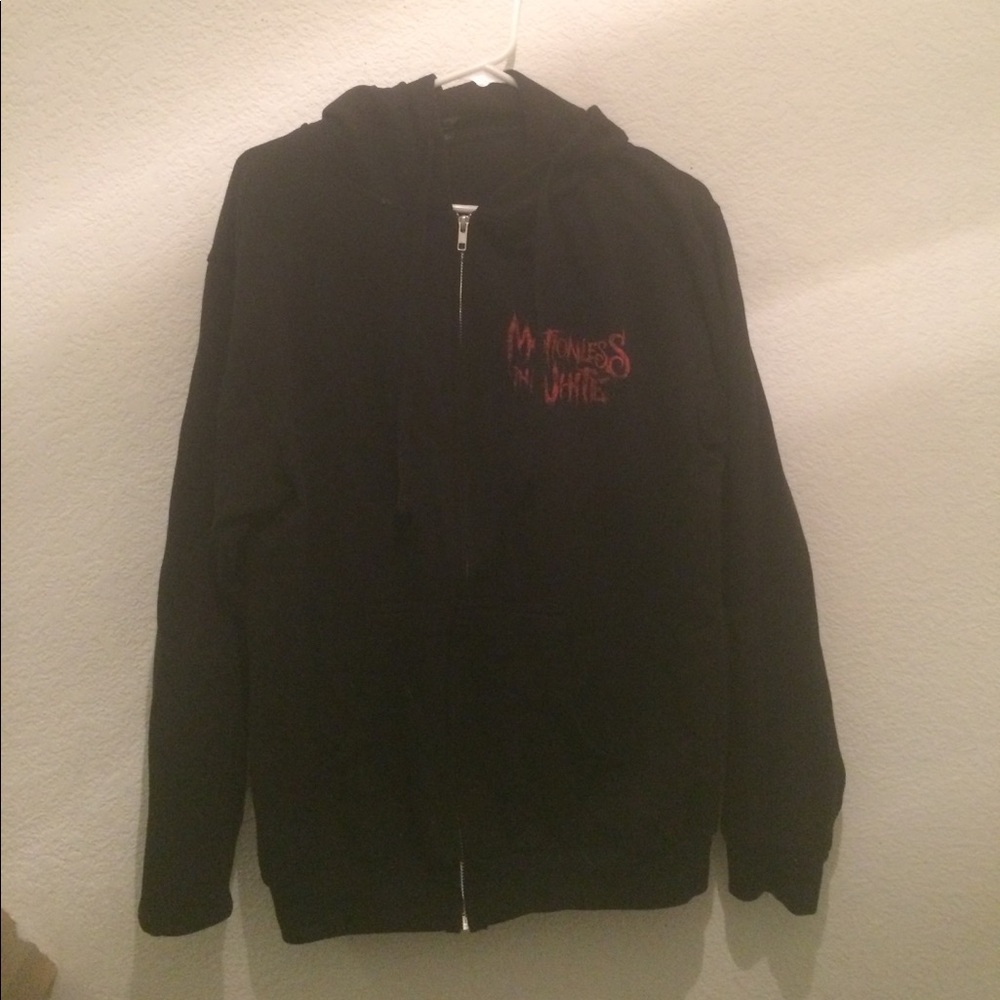 Motionless in white zip up sweater
