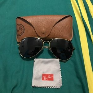 Black and gold ray bans