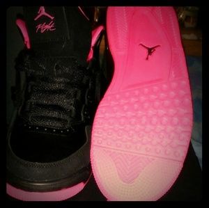 Pink and black Air jordan flights
