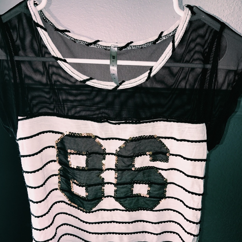 A black/white/gold top from Forever 21