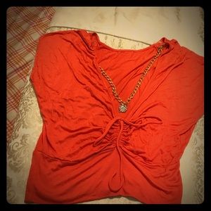 Coral open back shirt.