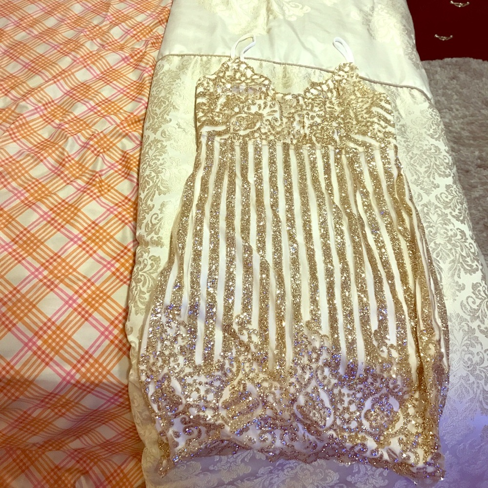 Glittery gold sexy dress.