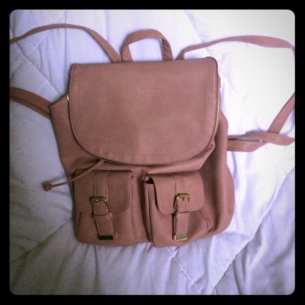 Beautiful rose pink backpack purse.