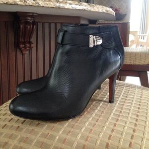 Black leather high heel ankle boots.