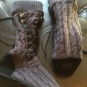 Grey Muk Luks sweater boot with black accent.