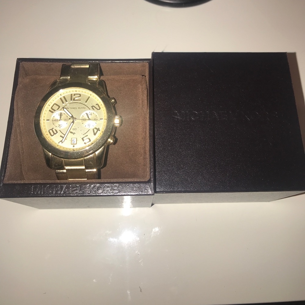 Micheal kors gold watch with original box.