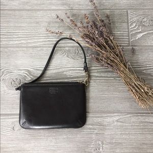 NWOT Authentic COACH black leather wristlet.