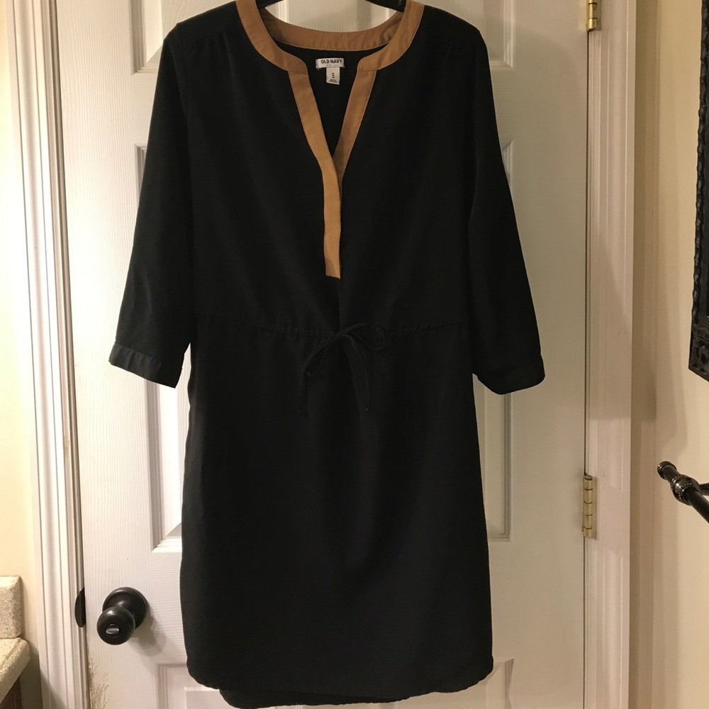 Black dress with brown/tan neckline. Tie at waist
