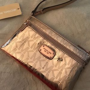 MK rose gold clutch