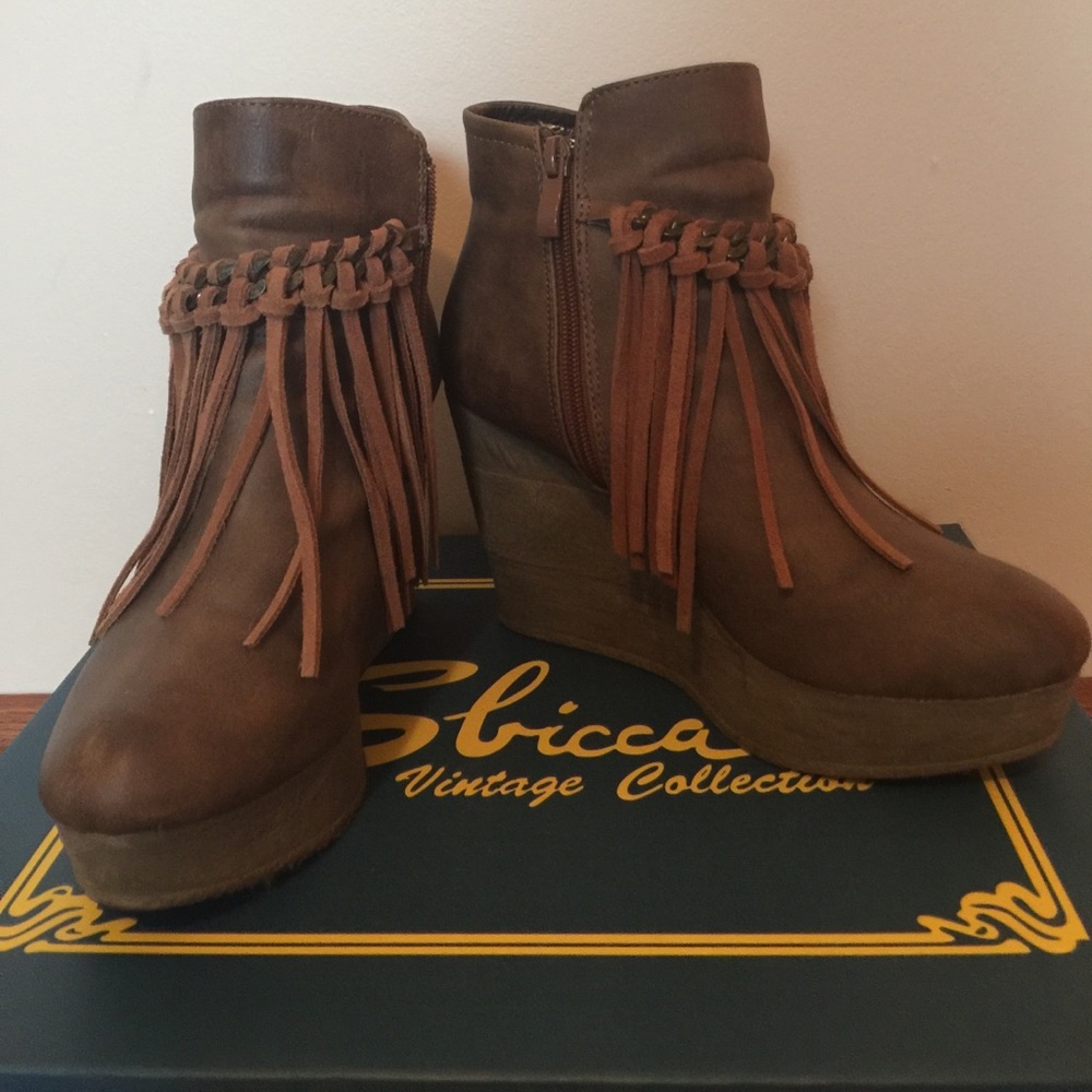 Sbicca wedge ankle boots with fringe.