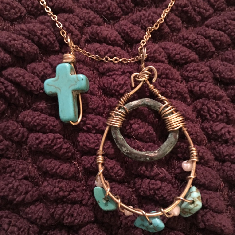 Long necklace with turquoise and pearl detail.