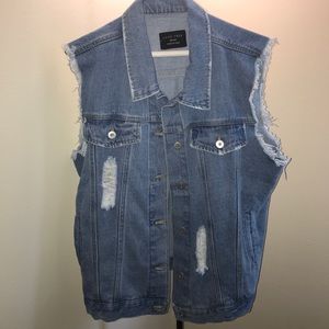 Distressed denim vest