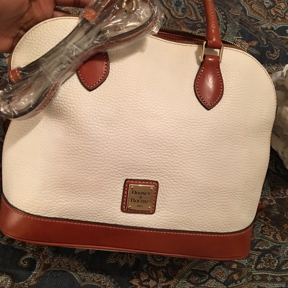 White Dooney &  bourke with red inside