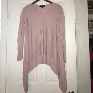 Pink long sleeved jagged bottom sweater.