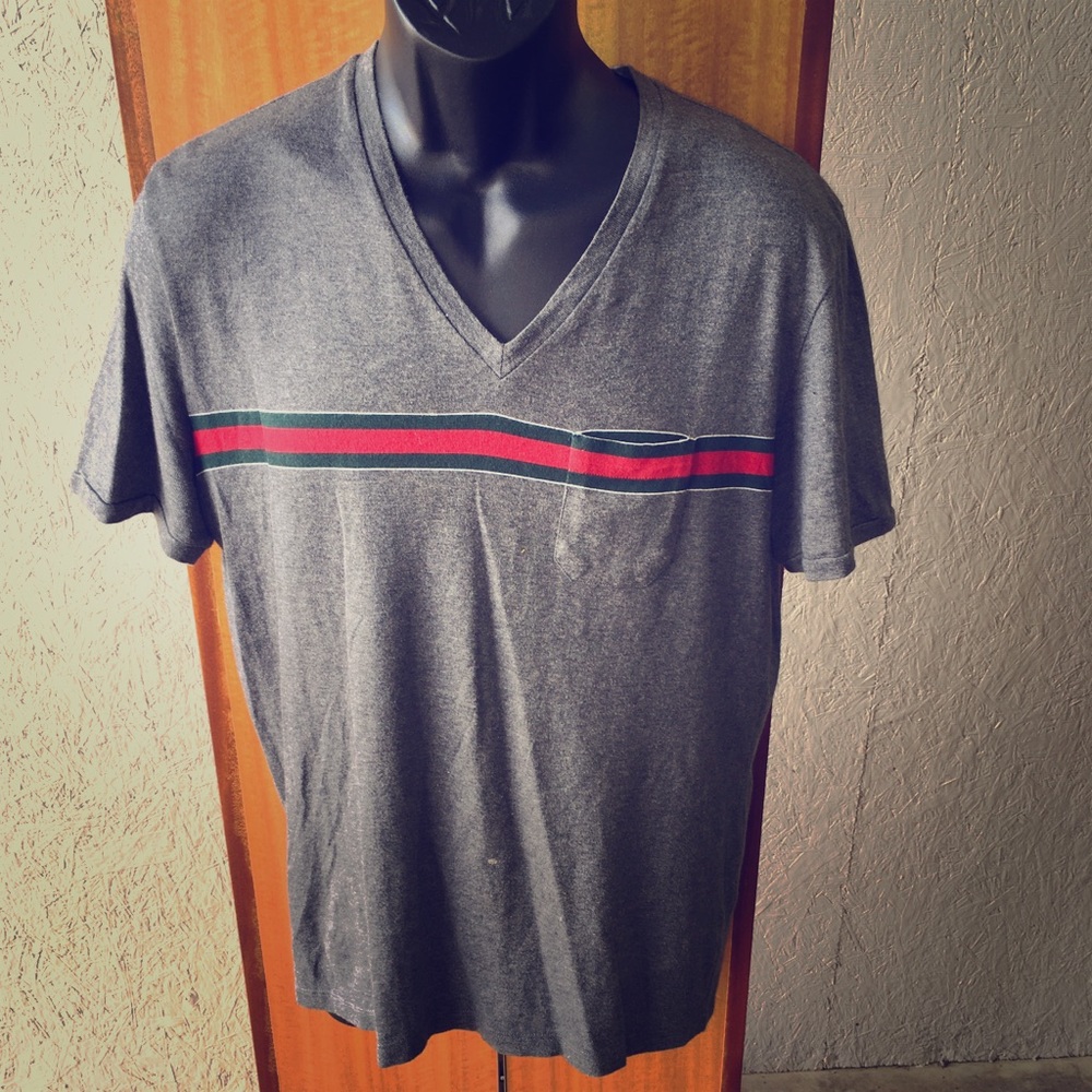 Gucci V-Neck t shirt with pocket on front.