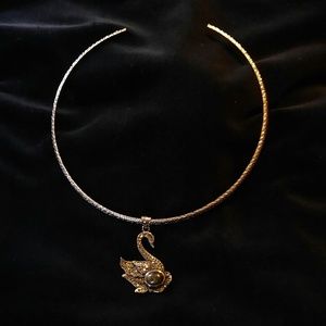 Swan with marcasite stones pendant on neck piece.