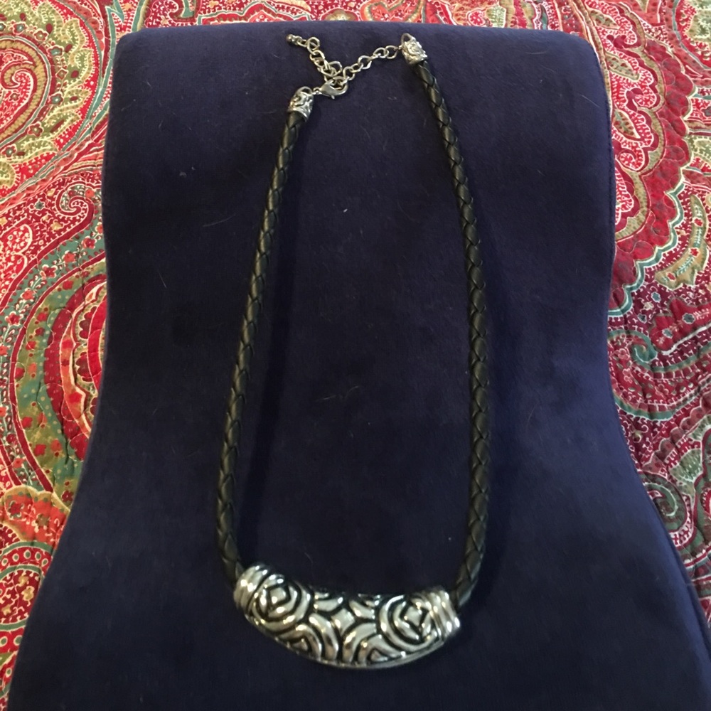Leather necklace with silver tone pendant