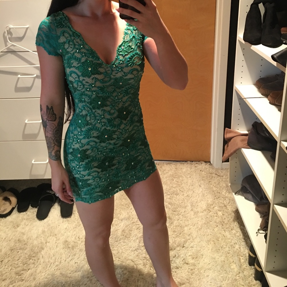 Green keyhole back dress with crystals by Holt.