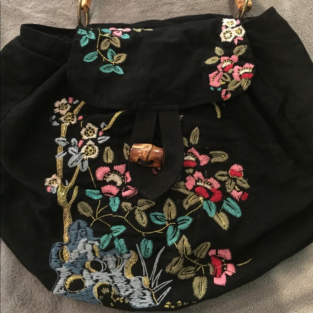 Anthropology embroidered purse with bamboo handle