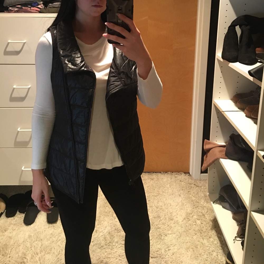 Black athletic puff vest by Reebok.