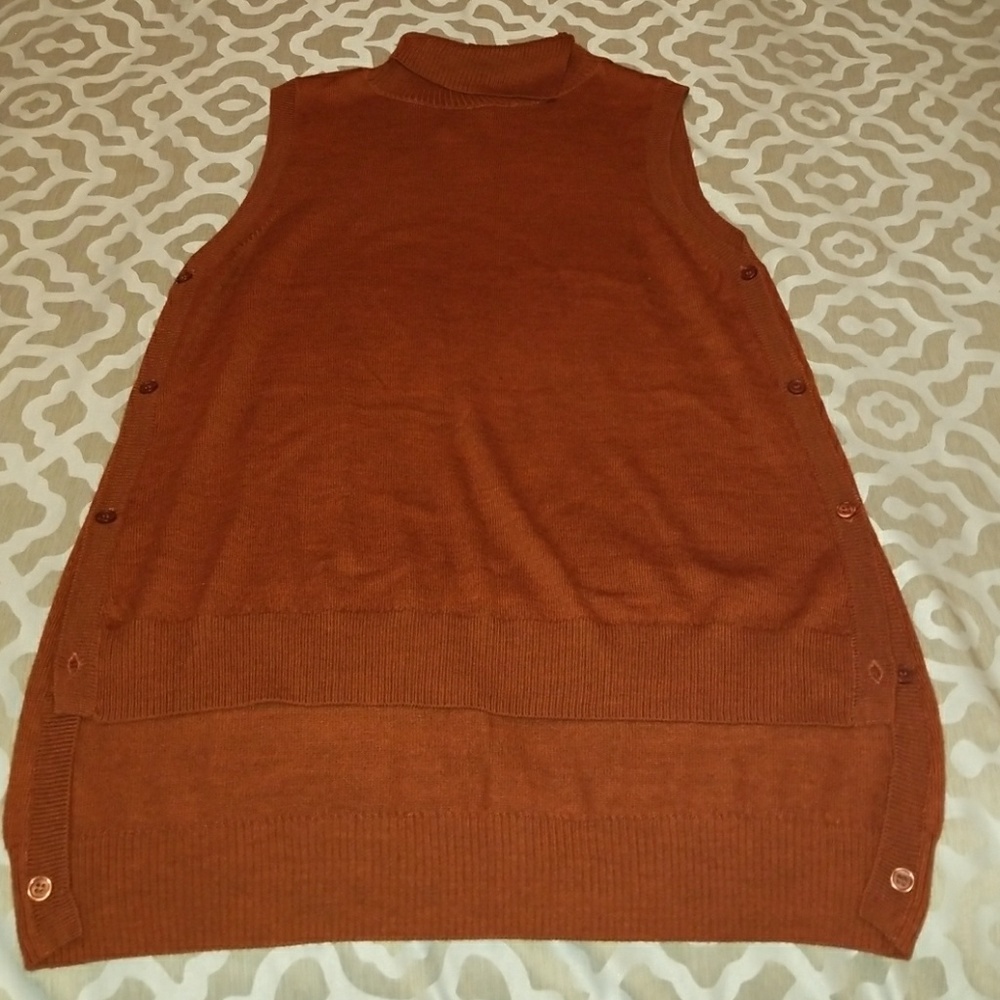 Sleeveless sweater with button down sides