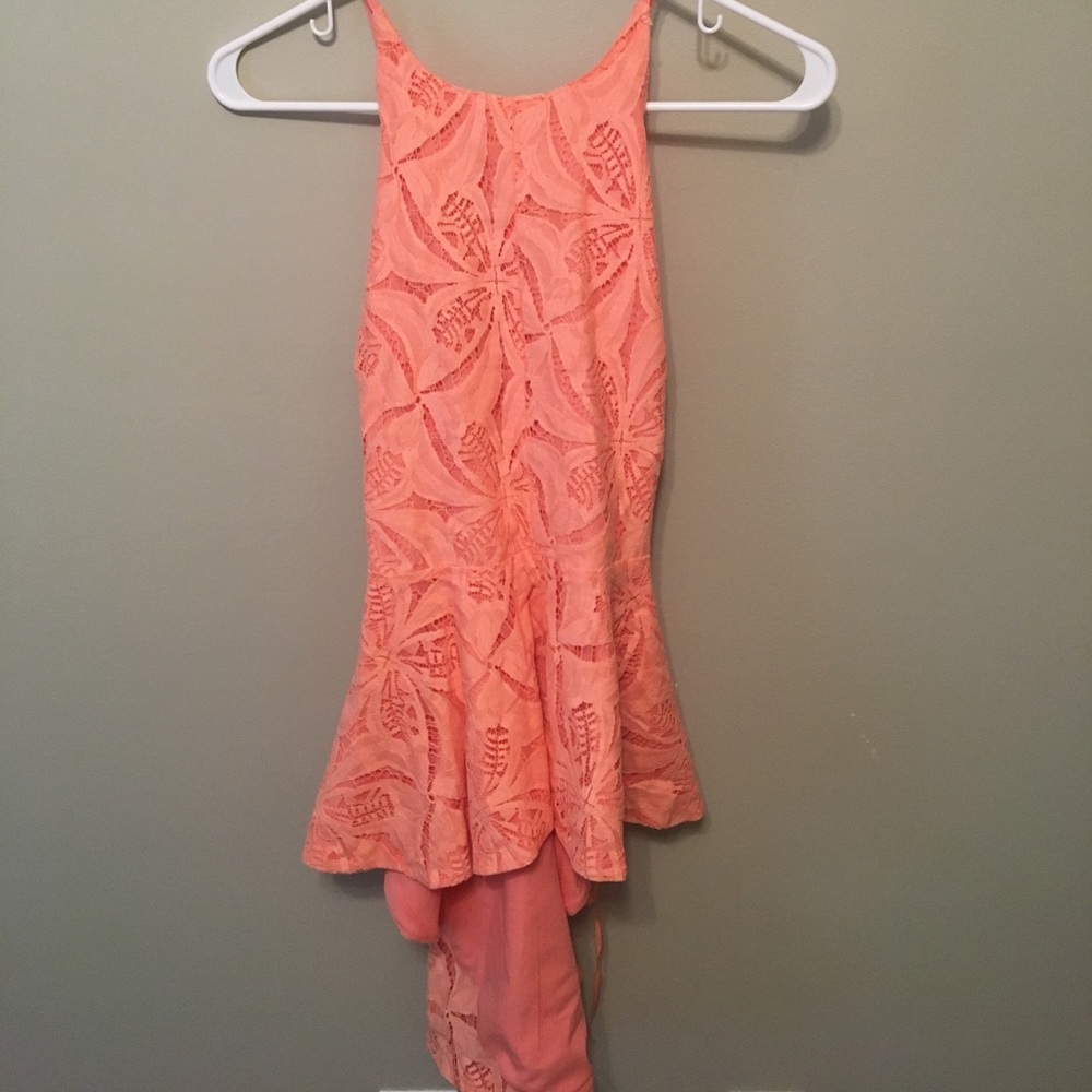 Tangerine Peplum Top. Brand New - Never worn.