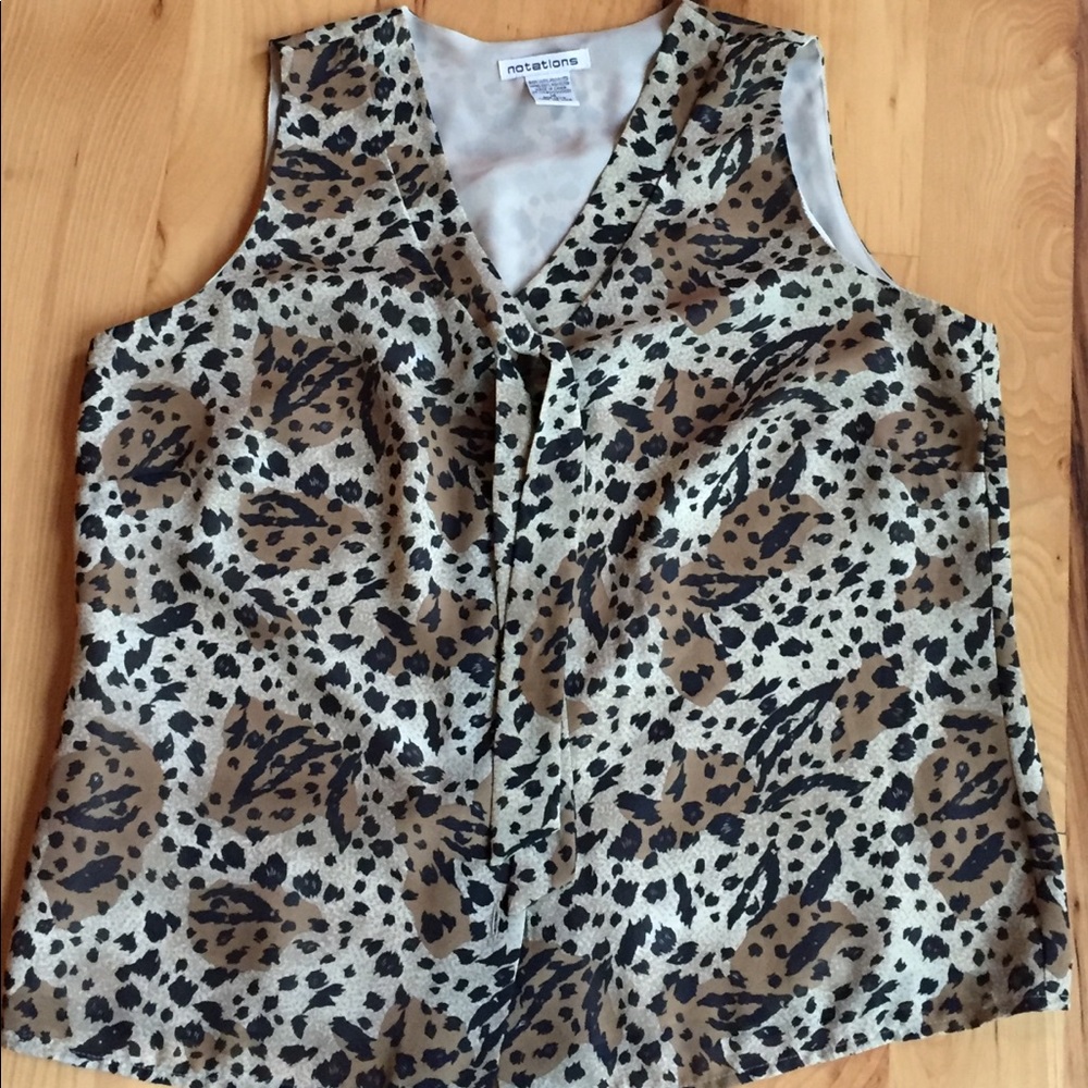 Sleeveless button down top