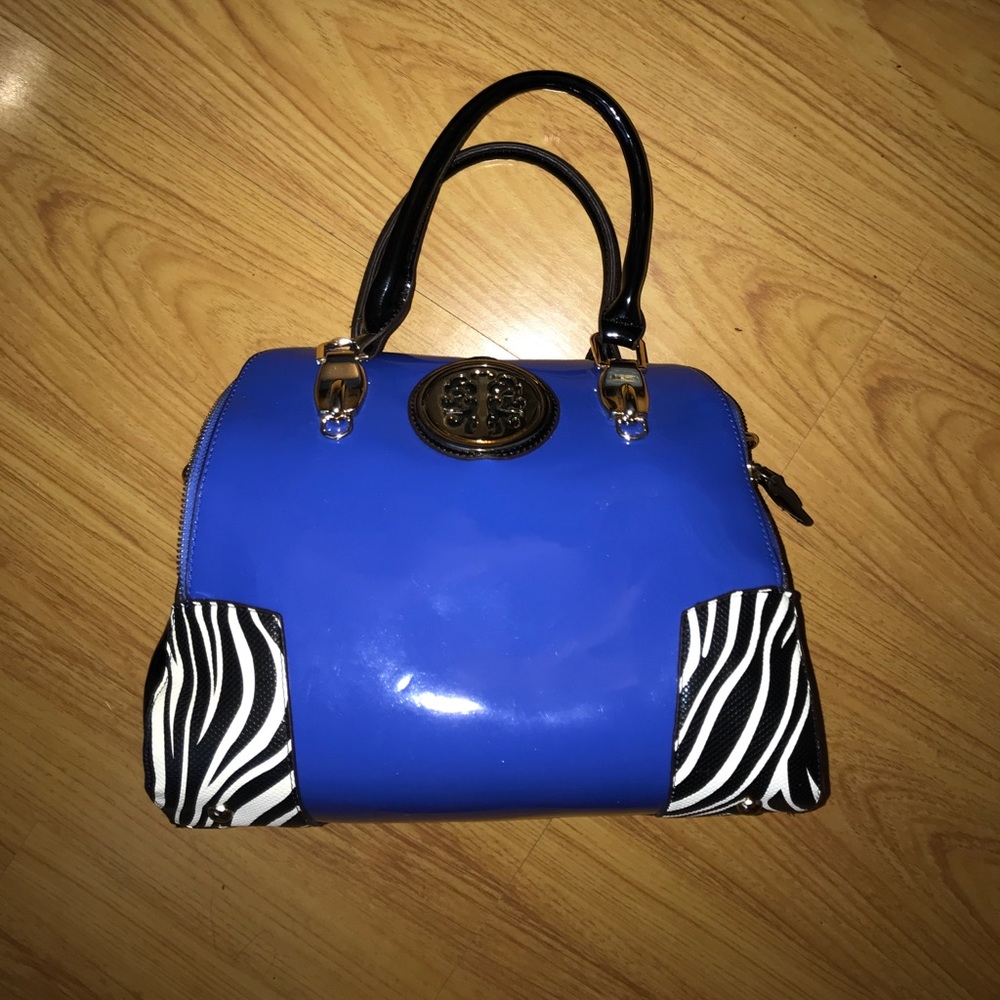 Patent blue and black handbag