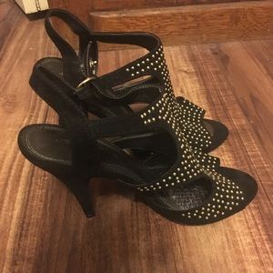 Black heel with gold jewels