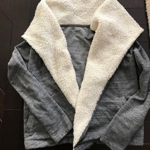 Heather gray sweatshirt with fur looking lapel.