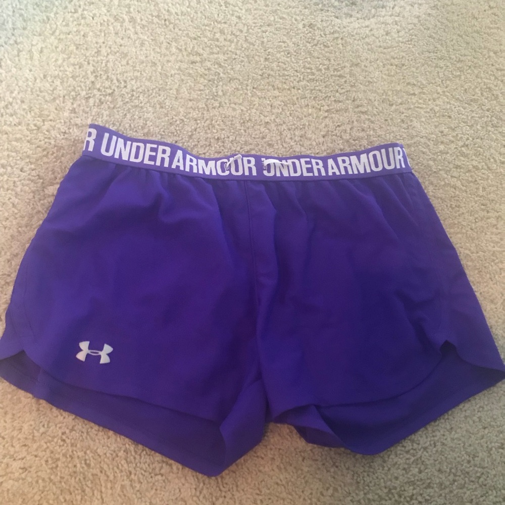 Under armour heatgear purple running shorts.