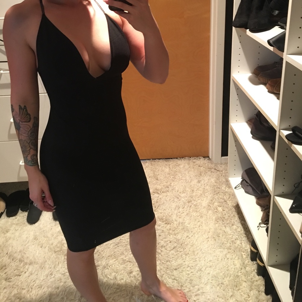 Sexy knee-length black dress with criss-cross back