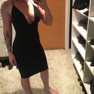 Sexy knee-length black dress with criss-cross back