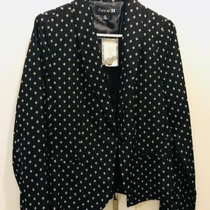 Black blazer with diamond designs in cream
