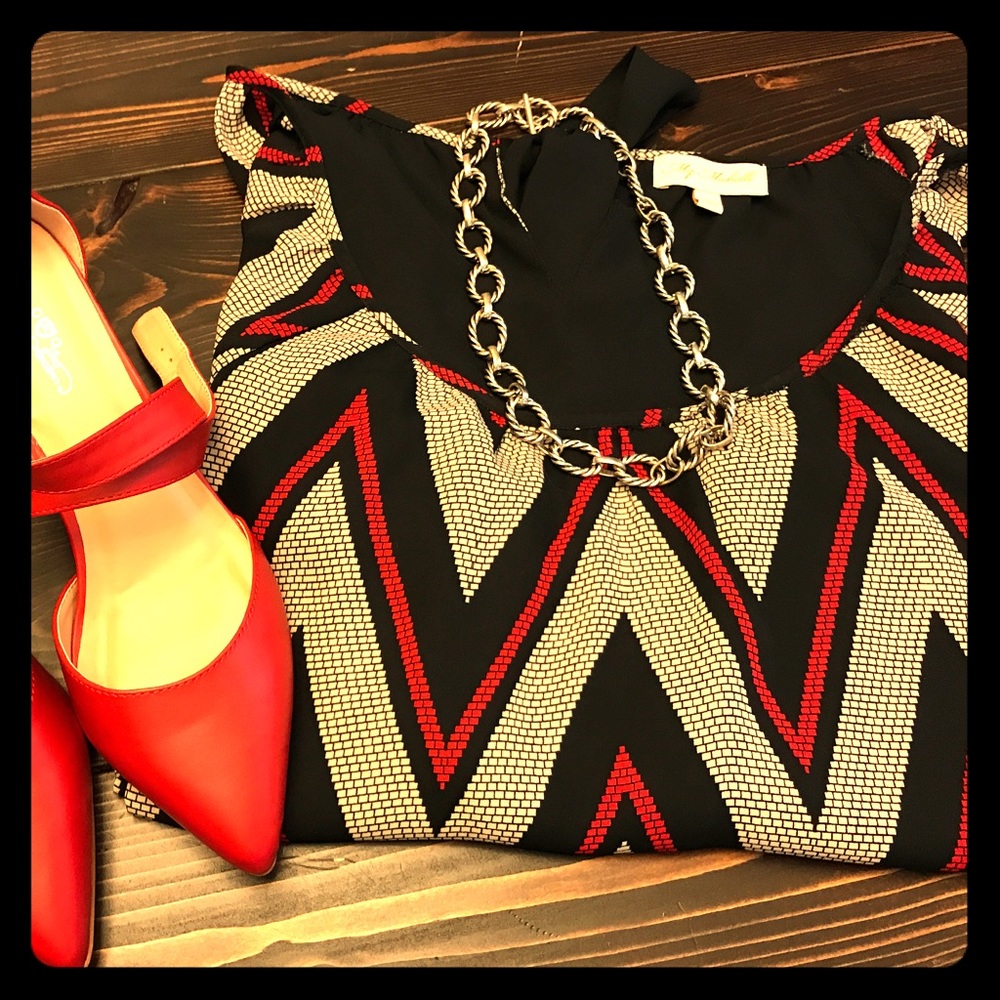Comfy black, red and cream colored blouse