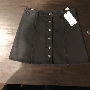 Black skirt with silver buttons