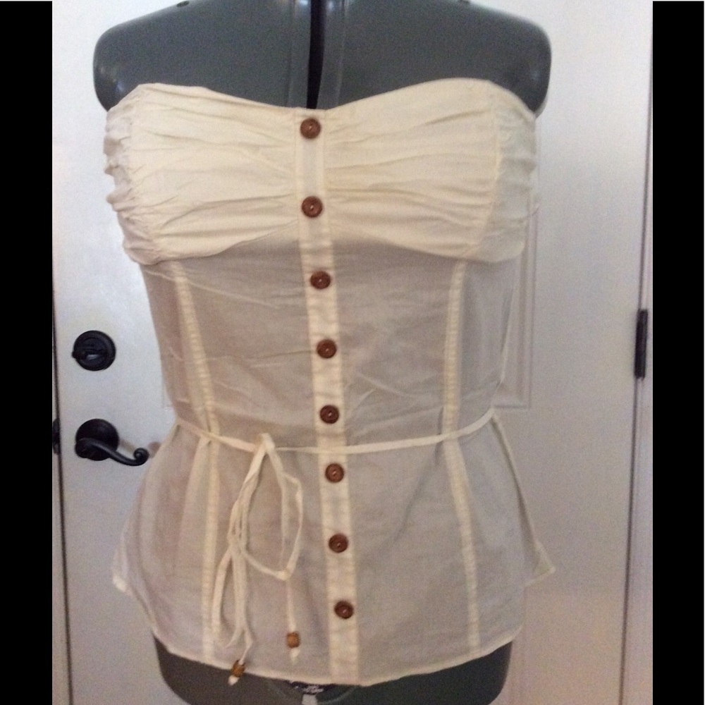 Cream colored , button-down, shirt.