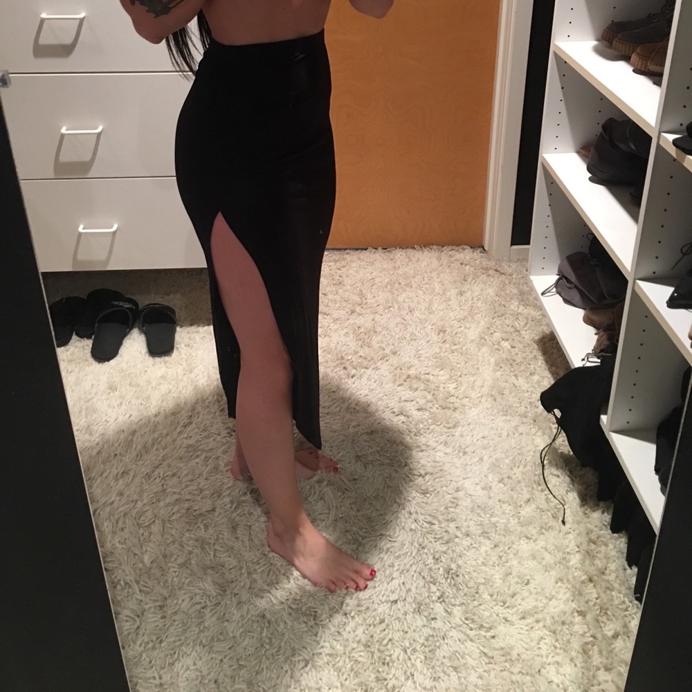 High waisted asymmetrical slit black skirt. NWT.