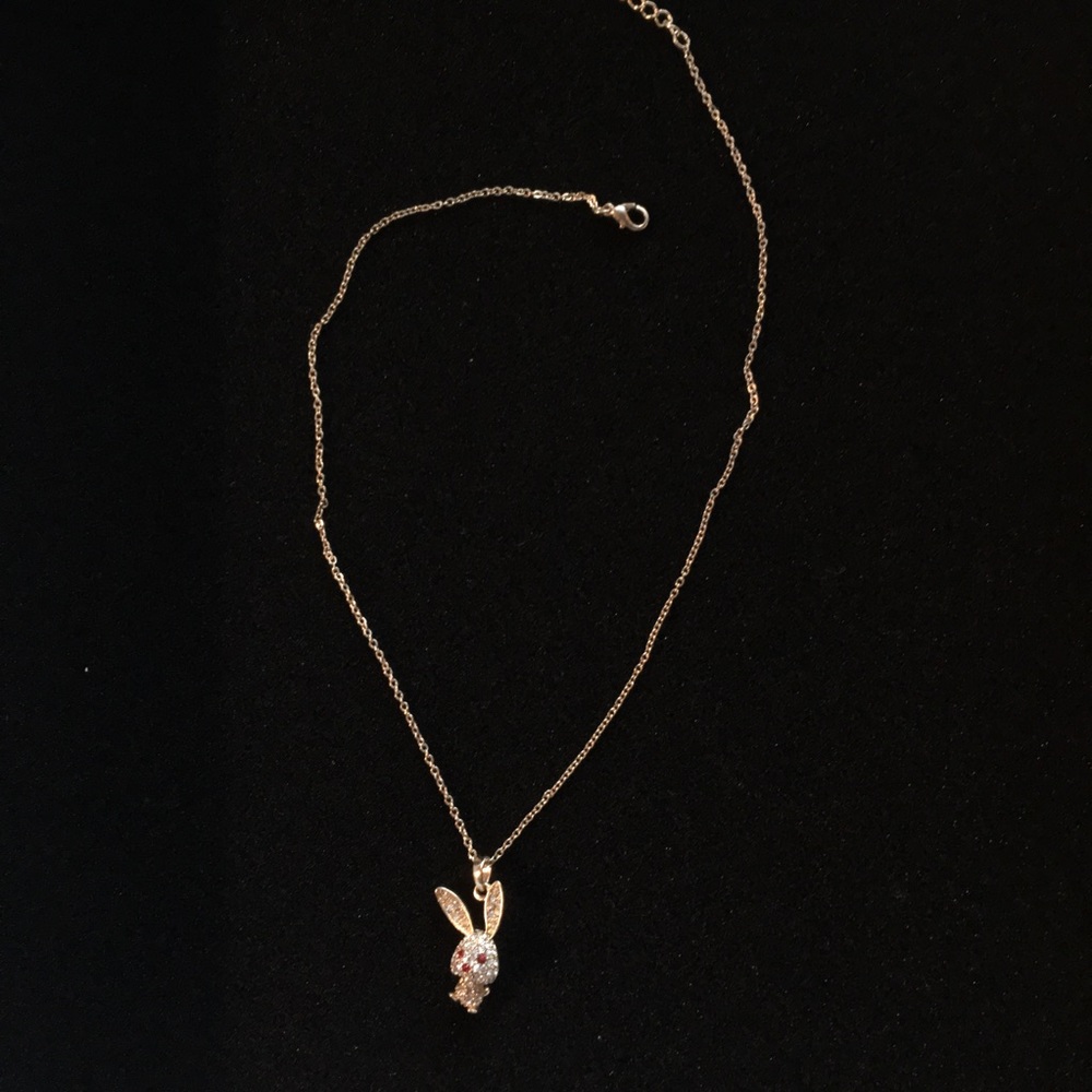 Small rabbit pendant necklace with ruby eyes