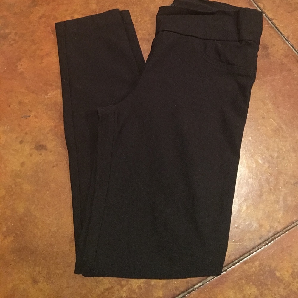 Black ankle length cigarette pants.