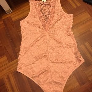 Pink lacy body suit
